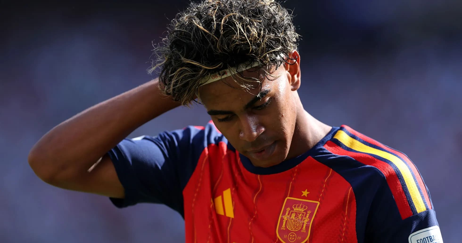 Player in Spain kit looking down during match Player in Spain kit looking down during match