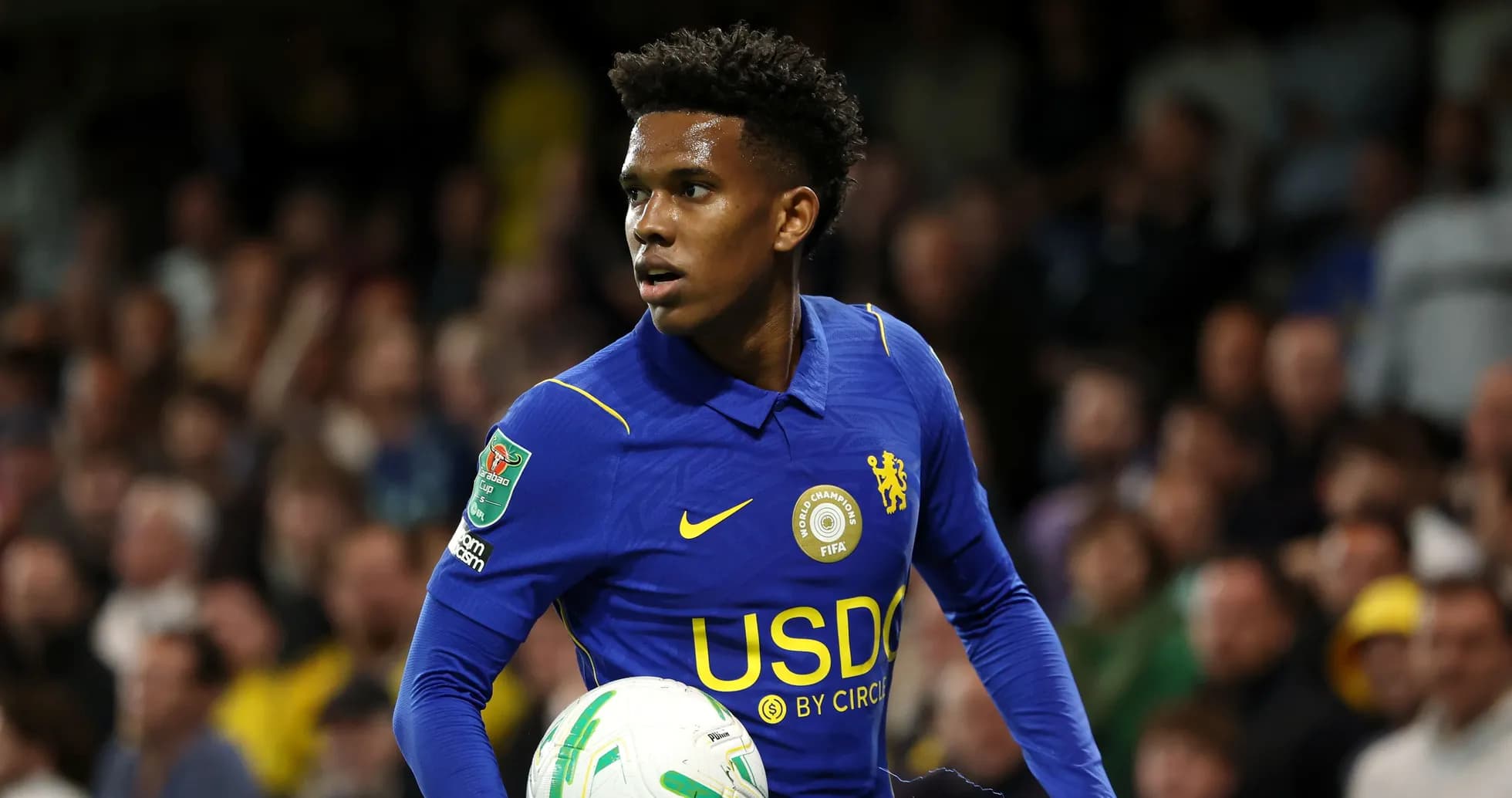 Player in blue kit holding a football during match Player in blue kit holding a football during match