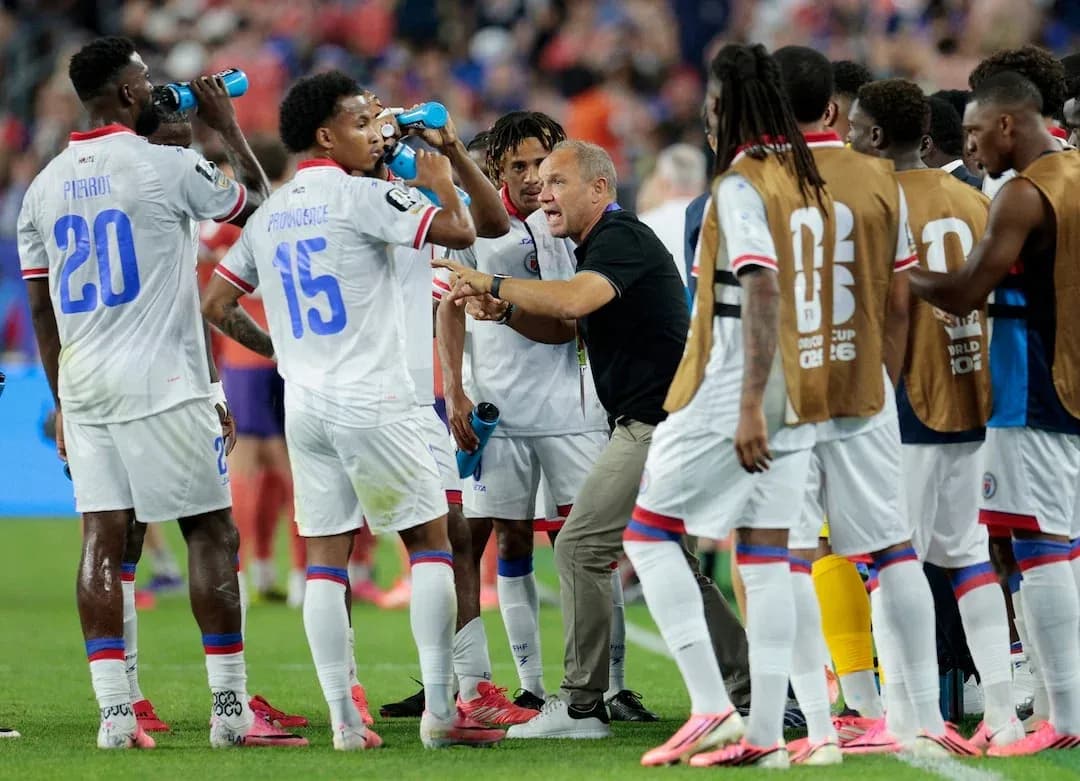Haiti players discussing strategy during a match Haiti players discussing strategy during a match