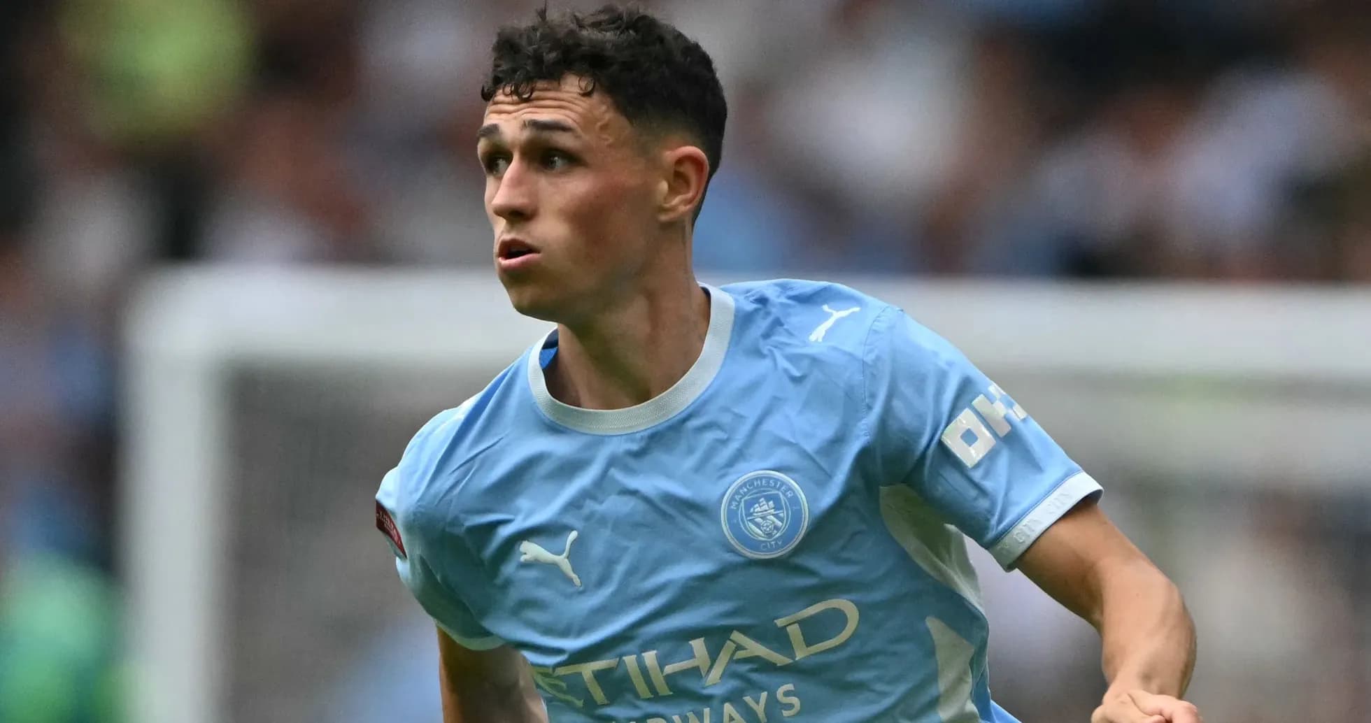 Phil Foden running during Manchester City match Phil Foden running during Manchester City match