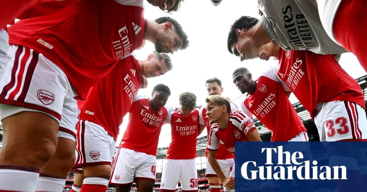 Arsenal players huddled together before match Arsenal players huddled together before match