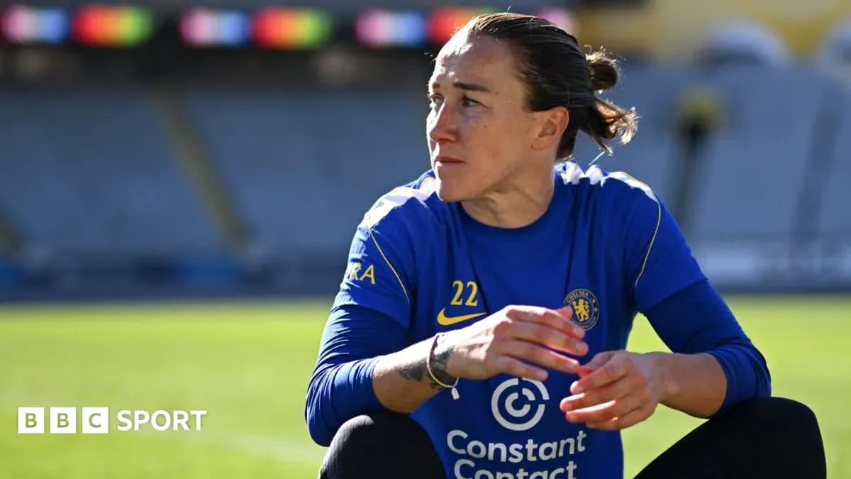 Player in blue kit sitting on pitch during training Player in blue kit sitting on pitch during training