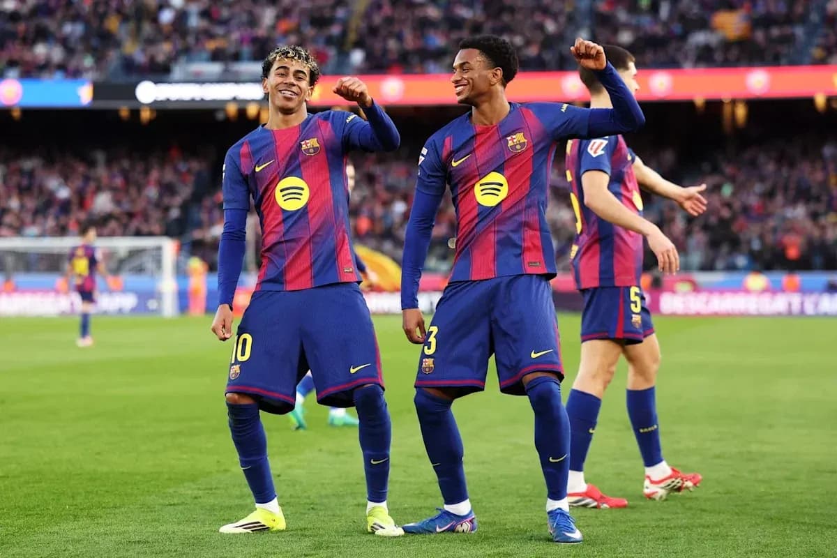 Two FC Barcelona players celebrating on the pitch Two FC Barcelona players celebrating on the pitch