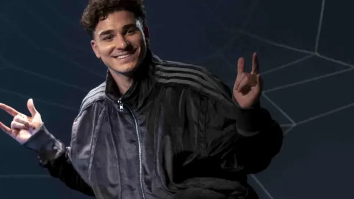 Person posing with hand gestures against dark background Person posing with hand gestures against dark background