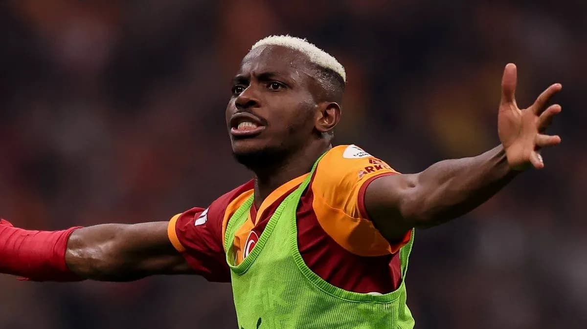 Player celebrating in Galatasaray jersey on field Player celebrating in Galatasaray jersey on field