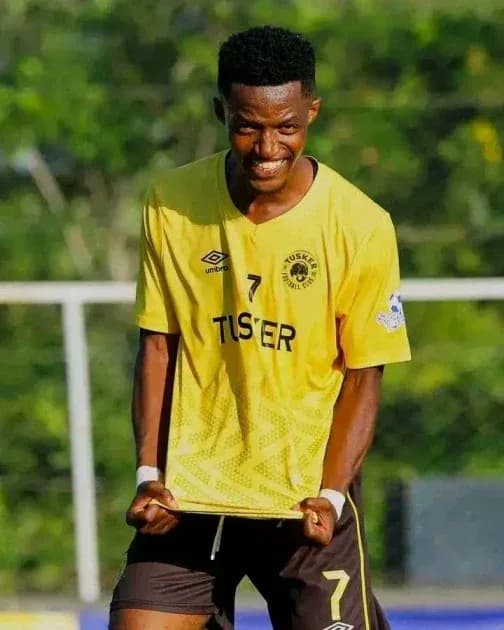 Player celebrating in yellow team jersey Player celebrating in yellow team jersey