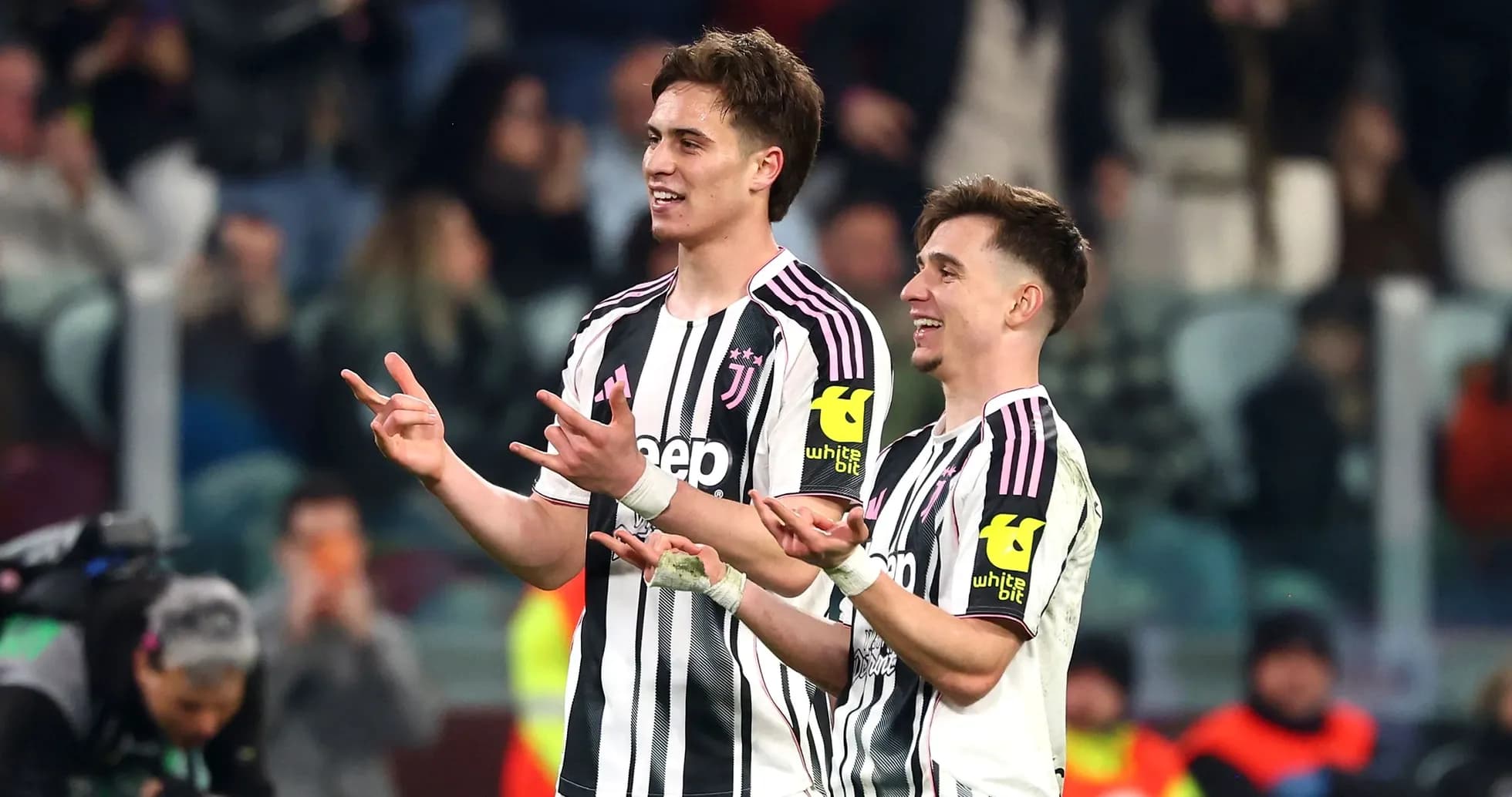 Two Juventus players celebrating on the pitch Two Juventus players celebrating on the pitch