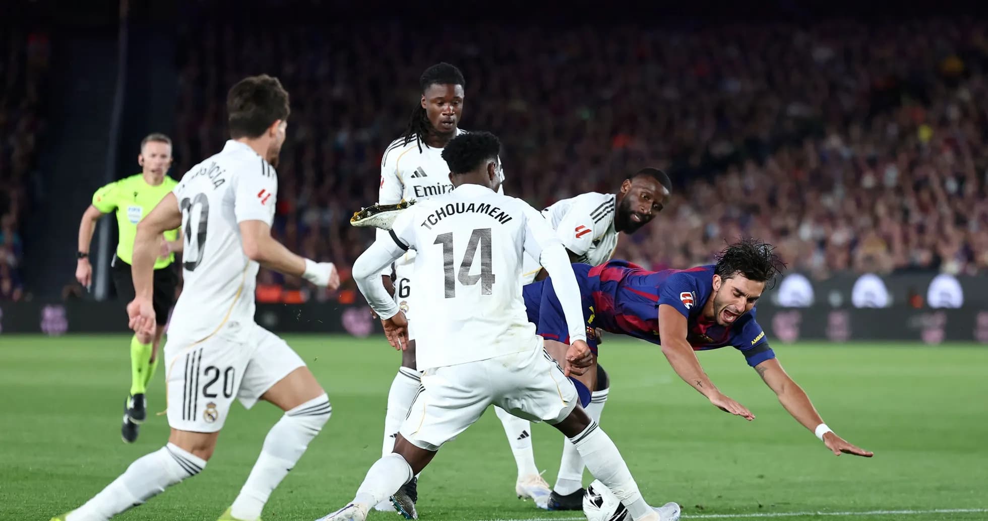 Barcelona player falling during match against Real Madrid Barcelona player falling during match against Real Madrid