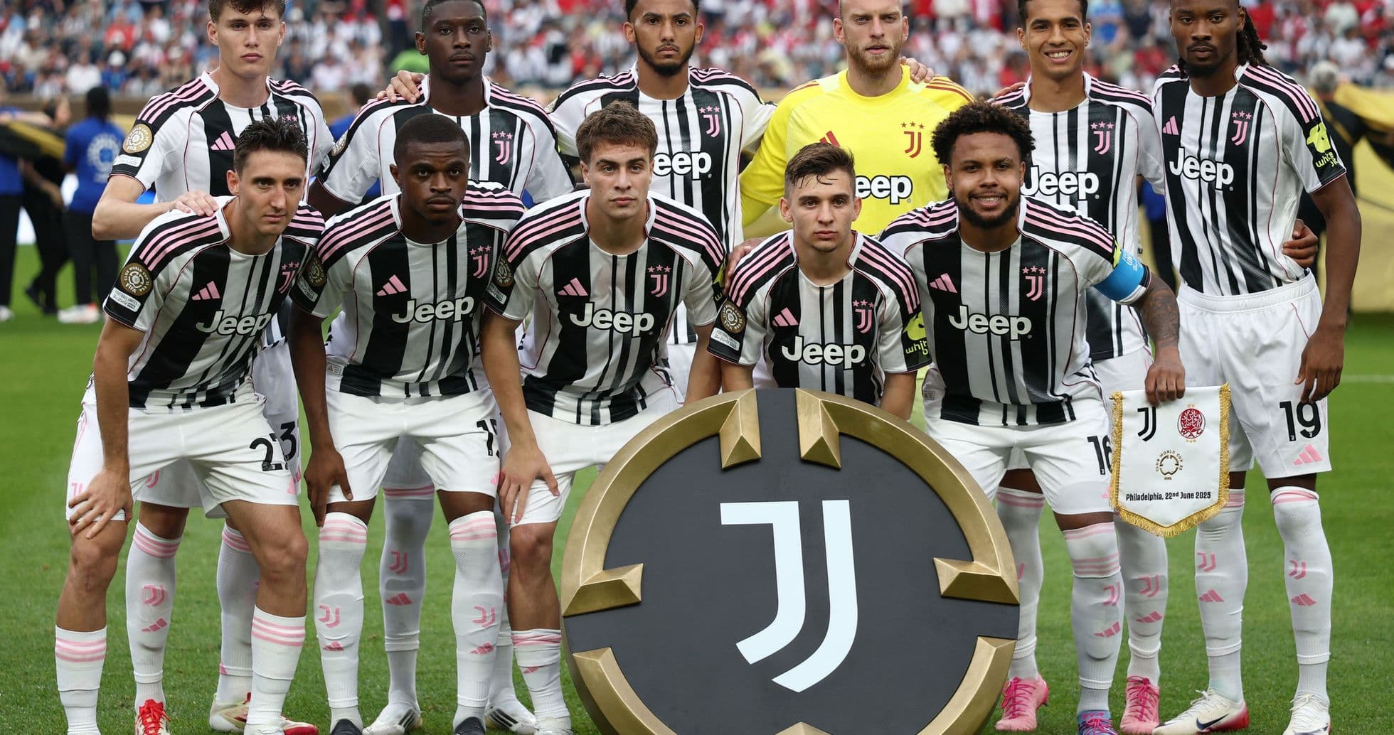 Juventus team posing with club banner before match Juventus team posing with club banner before match