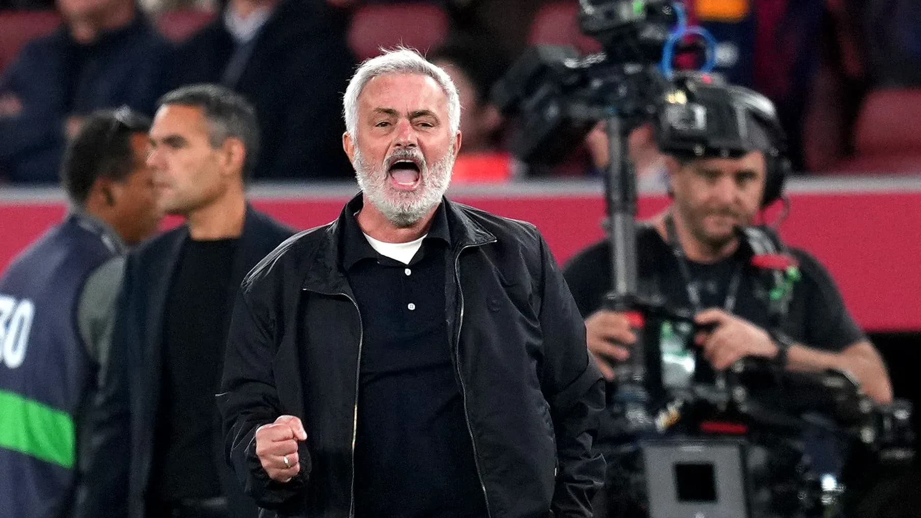 Manager celebrating passionately during a match Manager celebrating passionately during a match
