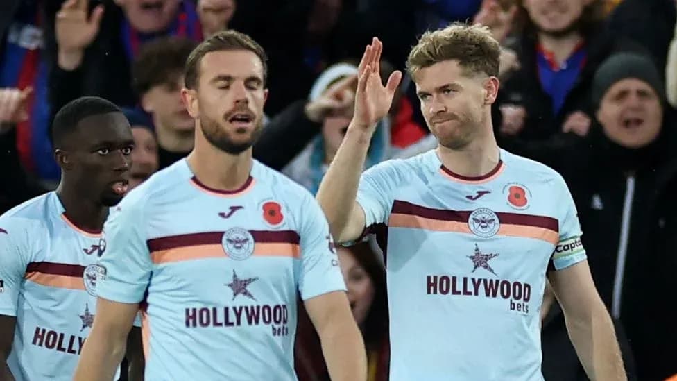 Players celebrating a goal during a match Players celebrating a goal during a match