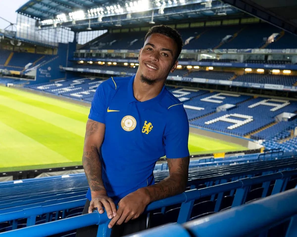 Player posing in stadium wearing blue jersey Player posing in stadium wearing blue jersey