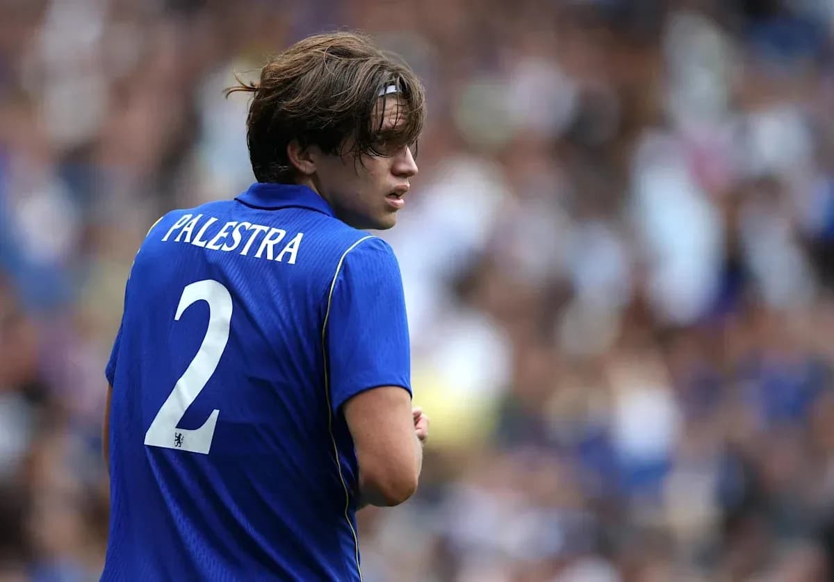 Player wearing blue jersey with 'Palestra' and number 2 Player wearing blue jersey with 'Palestra' and number 2