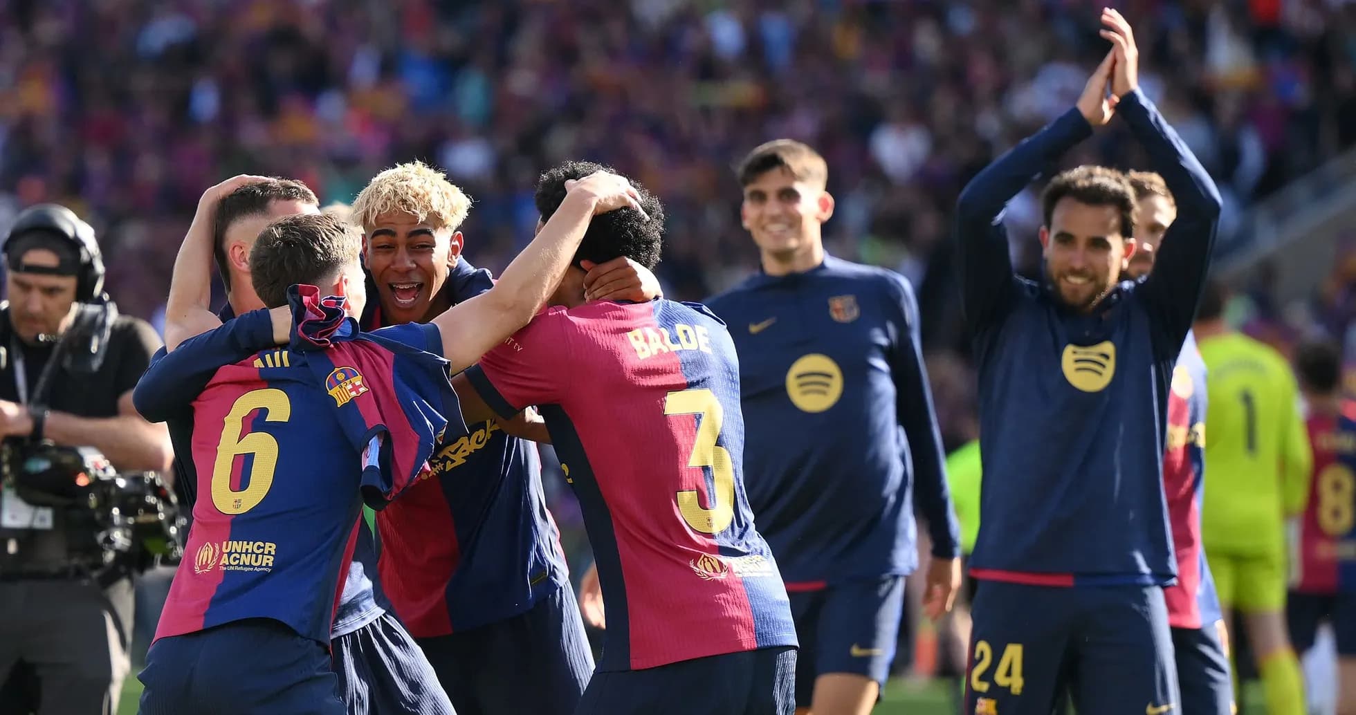 Barcelona players celebrating a goal on the pitch Barcelona players celebrating a goal on the pitch