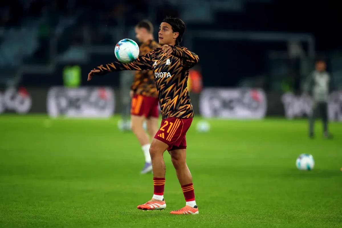 Player warming up while juggling the ball Player warming up while juggling the ball