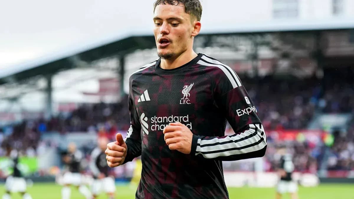 Liverpool player jogging during match at stadium Liverpool player jogging during match at stadium