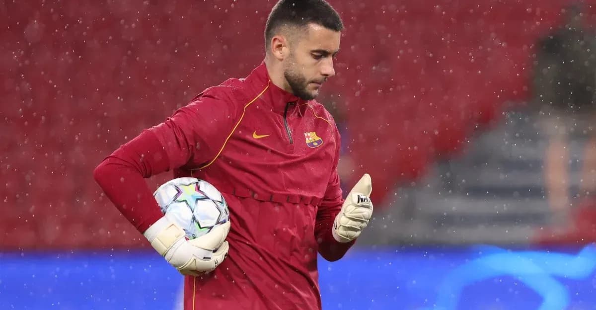 Goalkeeper in training with ball during rain Goalkeeper in training with ball during rain