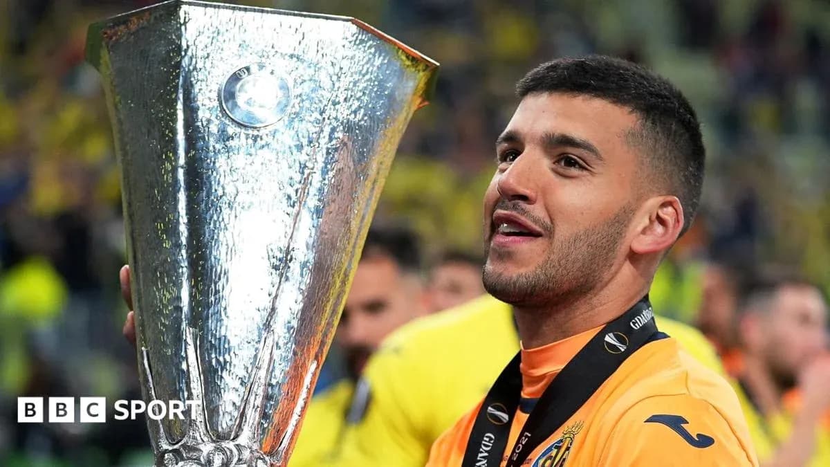 Player celebrating with UEFA Europa League trophy Player celebrating with UEFA Europa League trophy