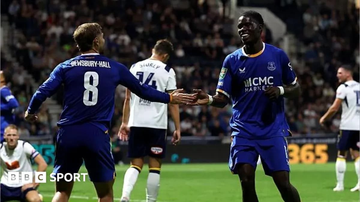 Two Everton players celebrating a goal on the pitch Two Everton players celebrating a goal on the pitch