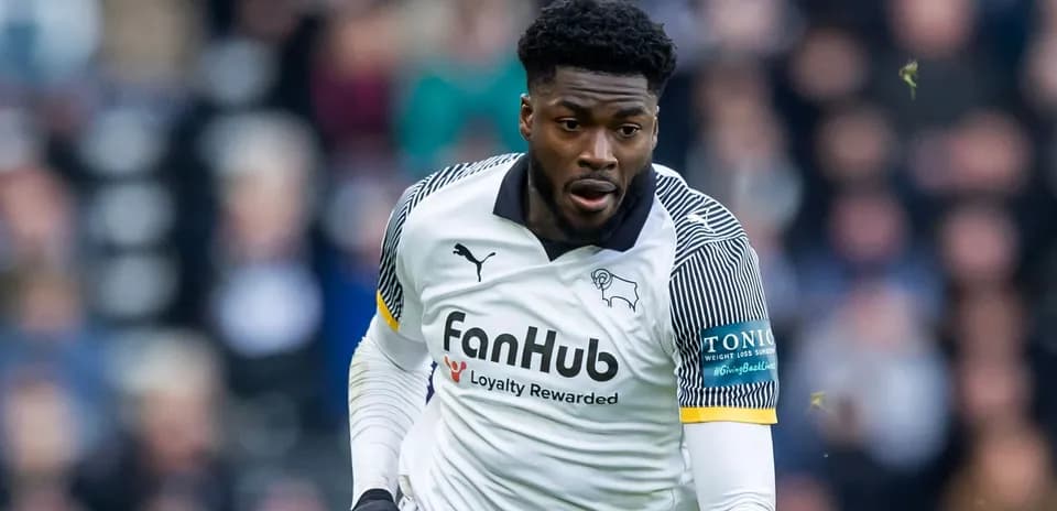 Player in action wearing Derby County kit Player in action wearing Derby County kit