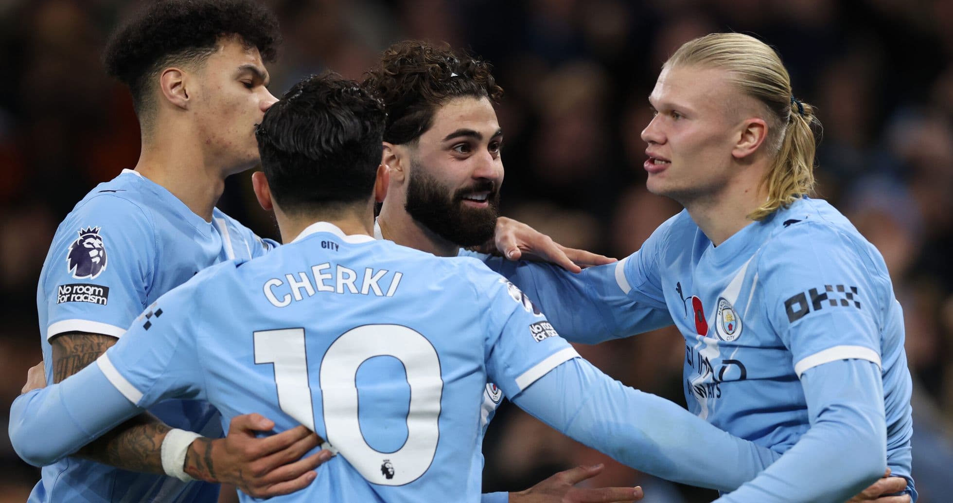 Manchester City players celebrating a goal Manchester City players celebrating a goal