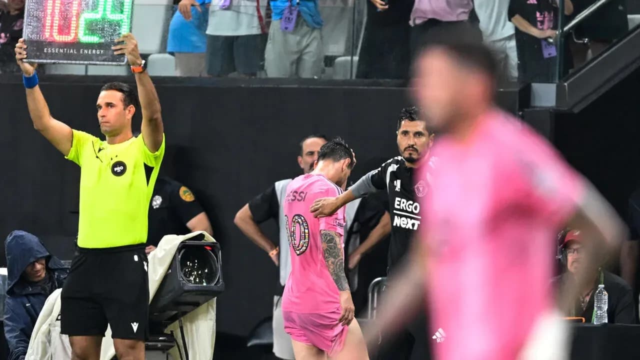 Substitution in progress with Messi leaving the field Substitution in progress with Messi leaving the field
