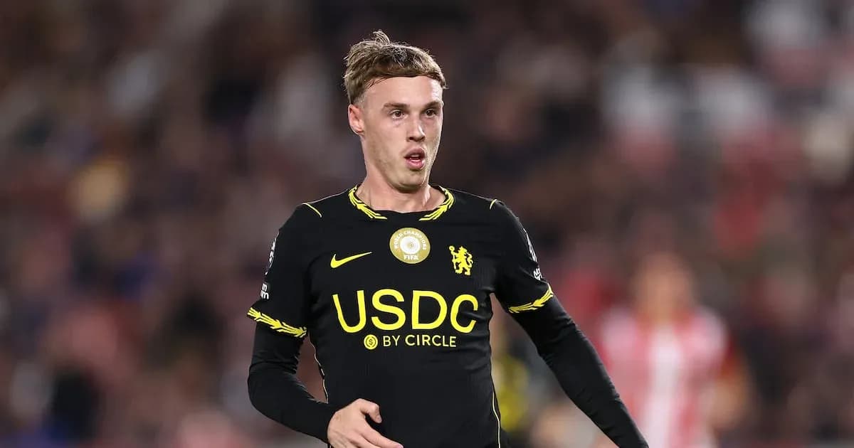 Player in black kit during football match Player in black kit during football match