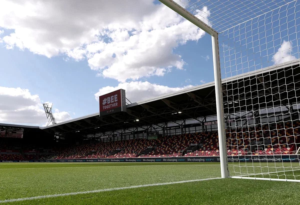 View of football goal and stadium stands View of football goal and stadium stands