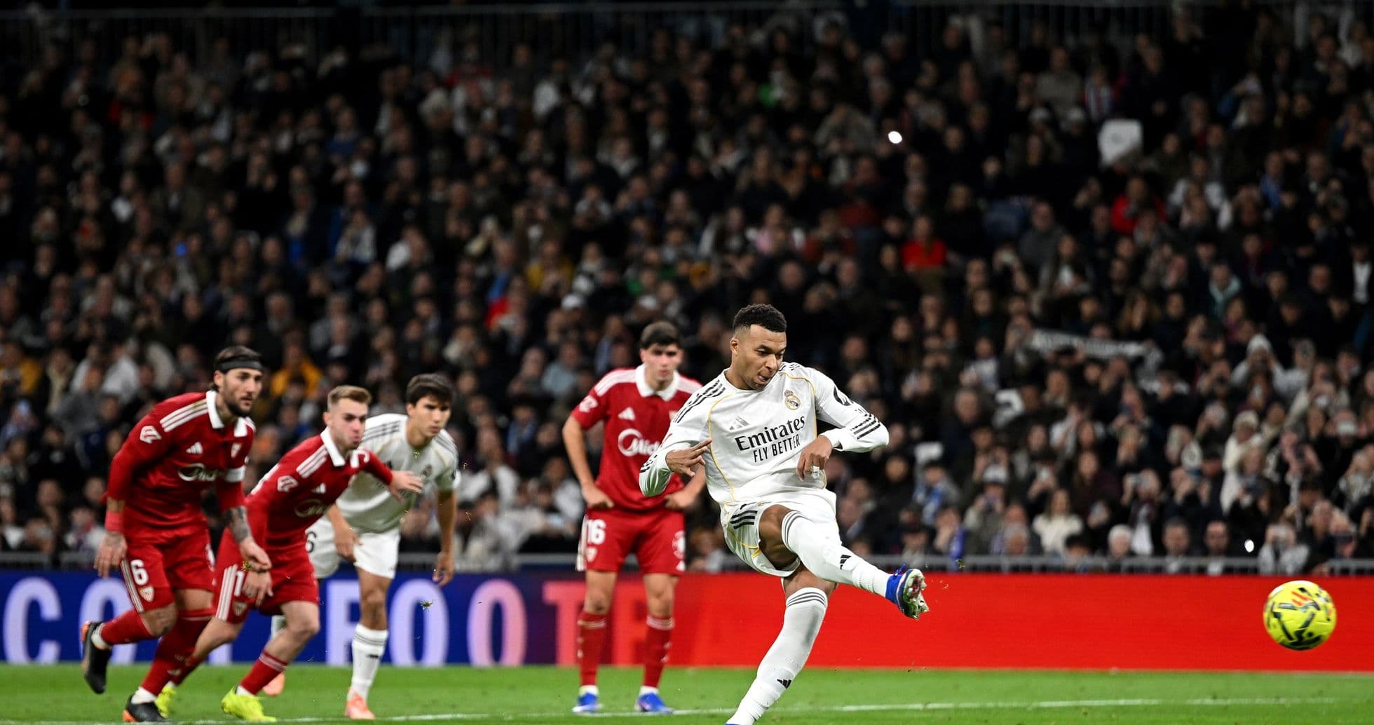 Real Madrid player taking a penalty kick Real Madrid player taking a penalty kick