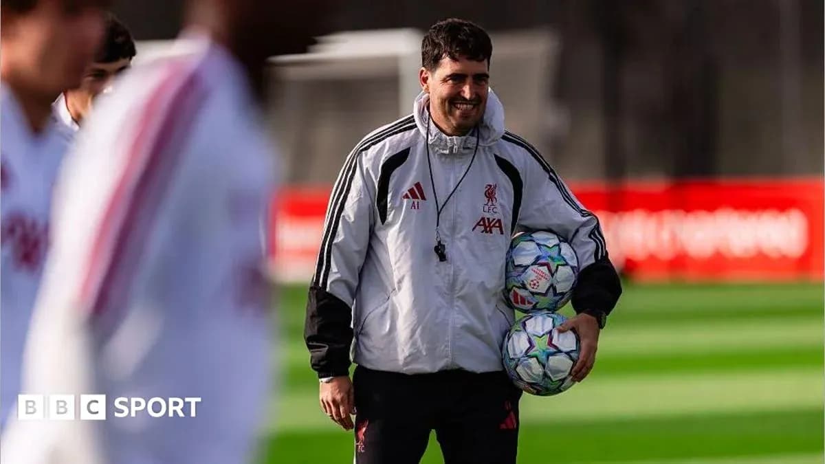 Coach holding soccer balls during training session Coach holding soccer balls during training session