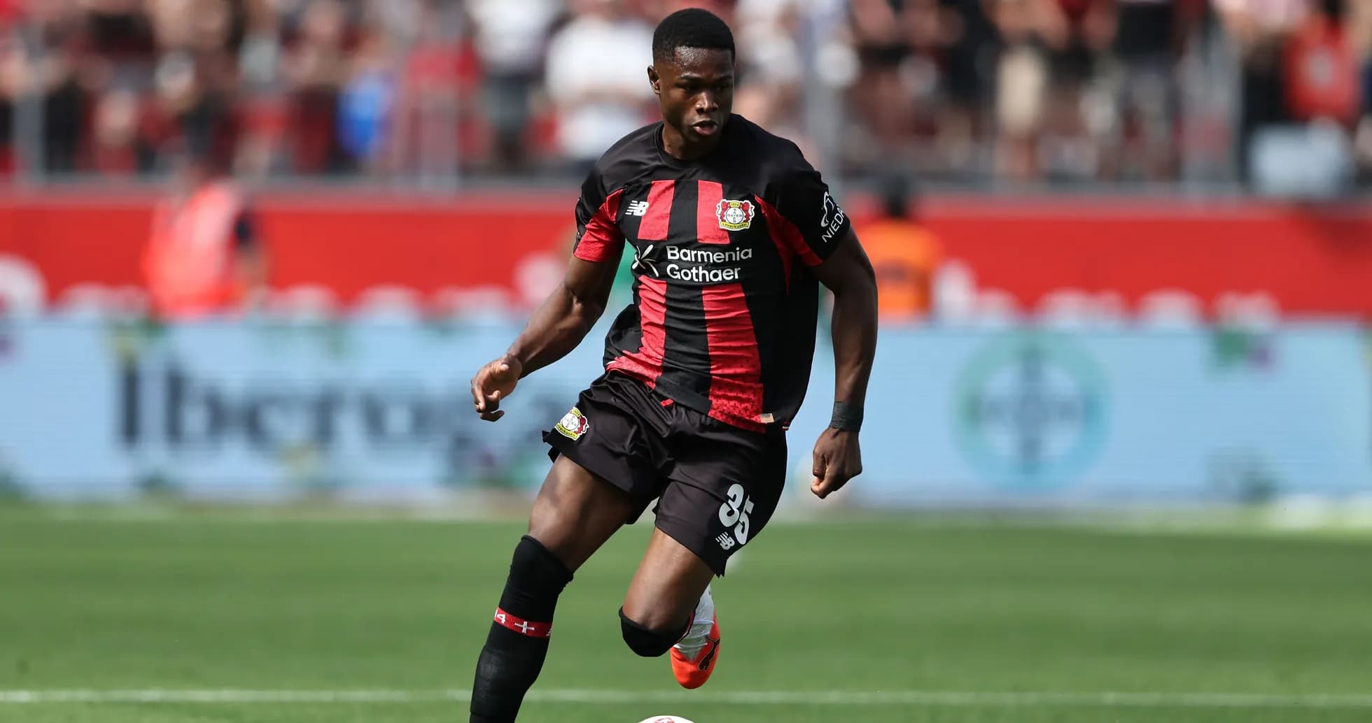 Player in action during a football match Player in action during a football match