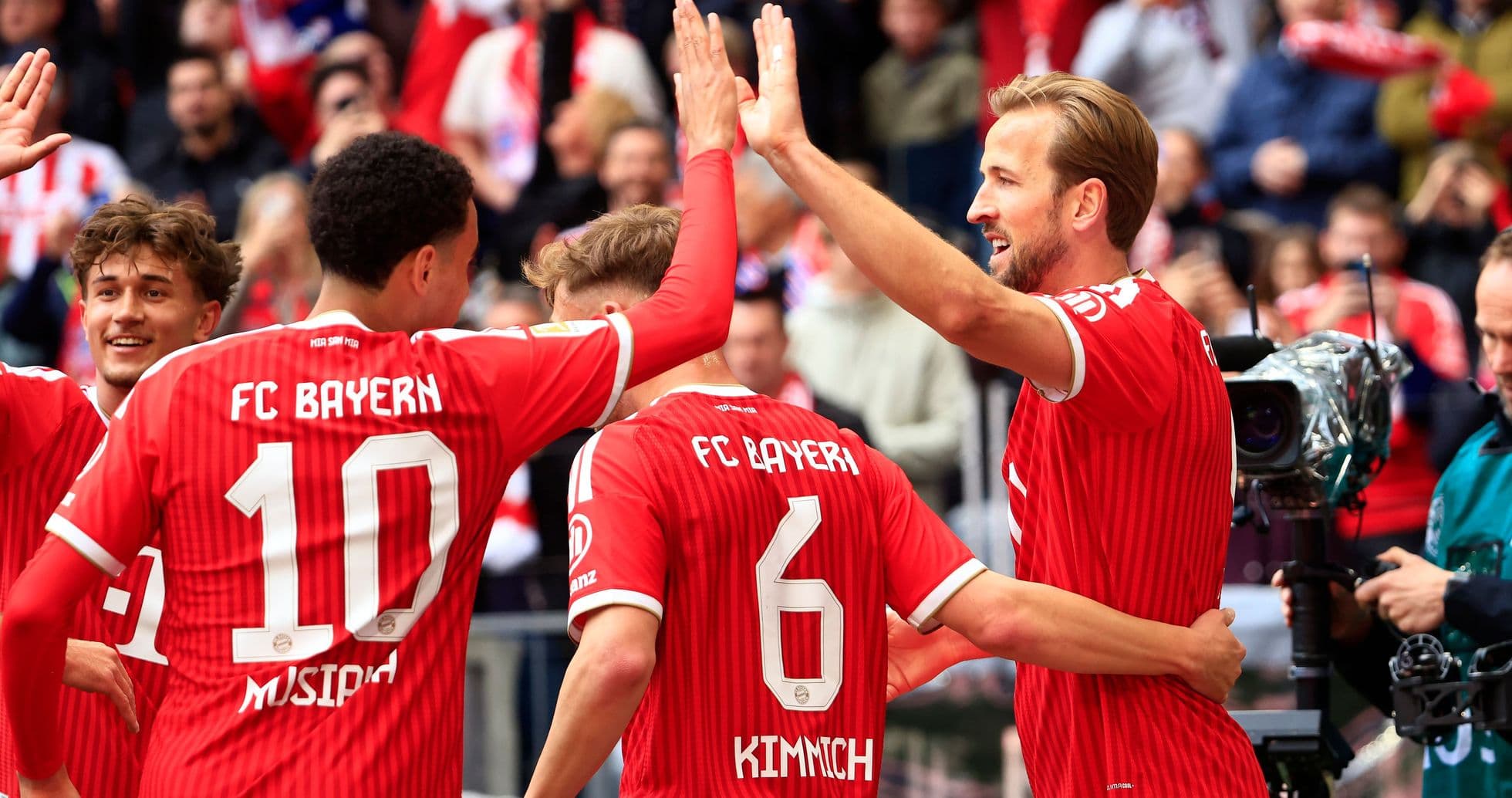 Bayern Munich players celebrating a goal together Bayern Munich players celebrating a goal together