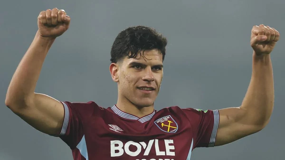 Player celebrating with raised fists in team jersey Player celebrating with raised fists in team jersey