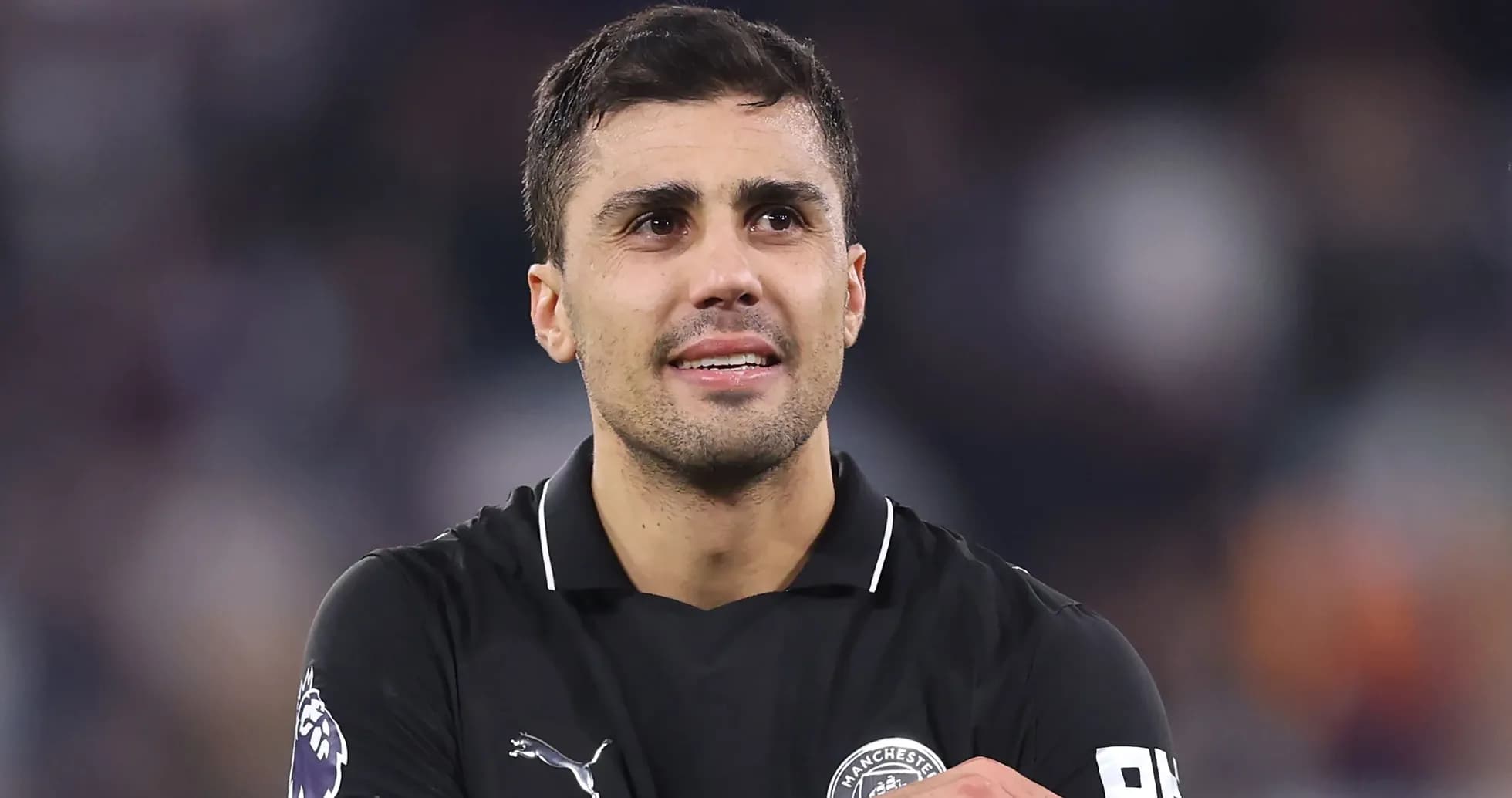 Player in black jersey during post-match celebration Player in black jersey during post-match celebration