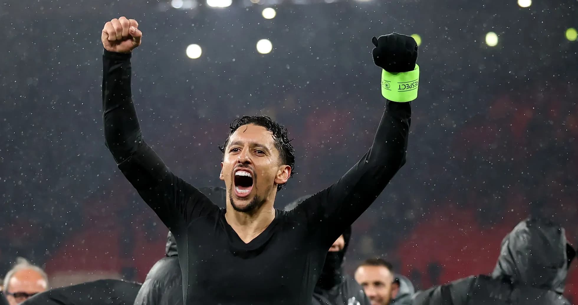 Player celebrating victory in the rain Player celebrating victory in the rain