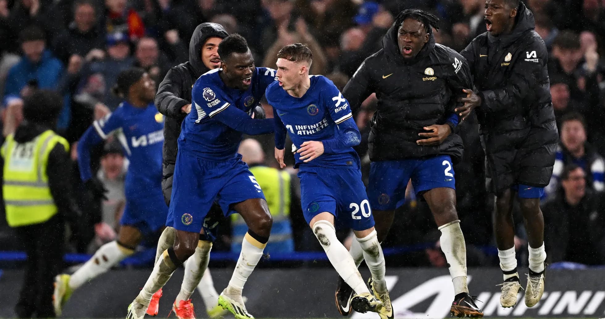 Chelsea players celebrating a goal during a match Chelsea players celebrating a goal during a match