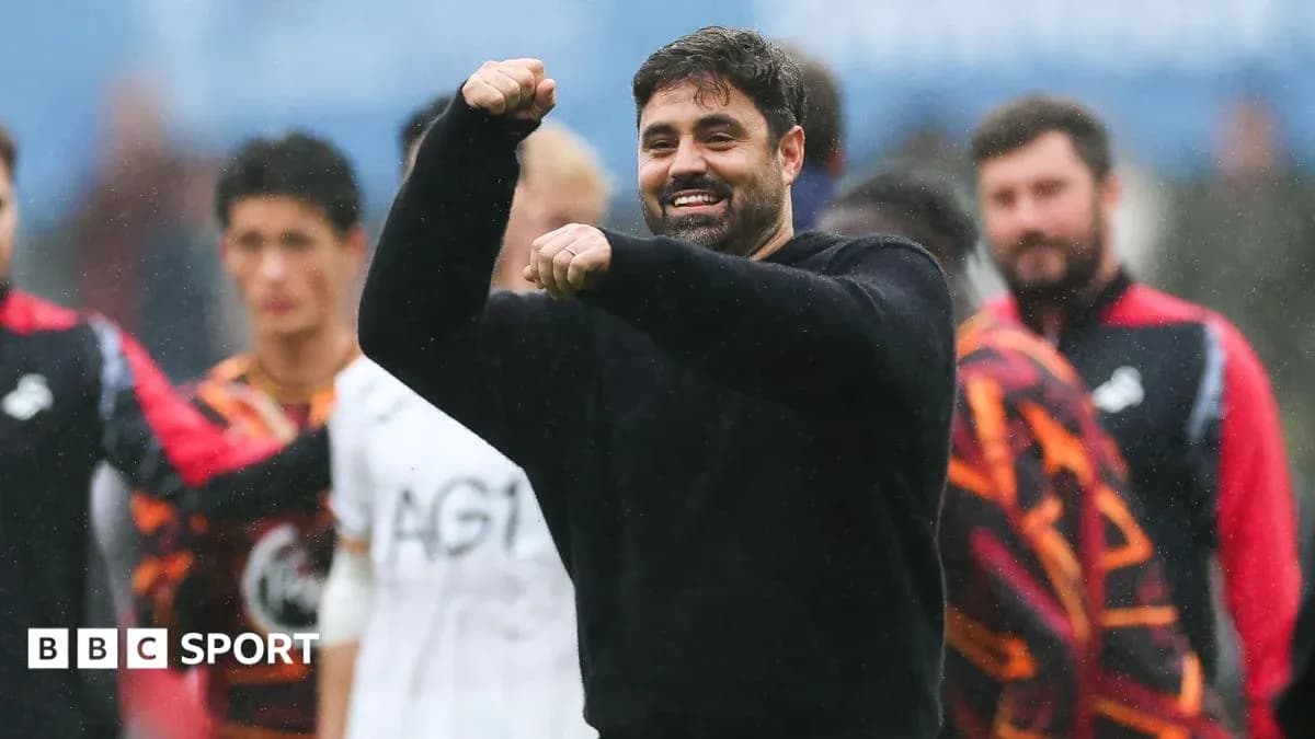 Coach celebrating with players after match victory Coach celebrating with players after match victory