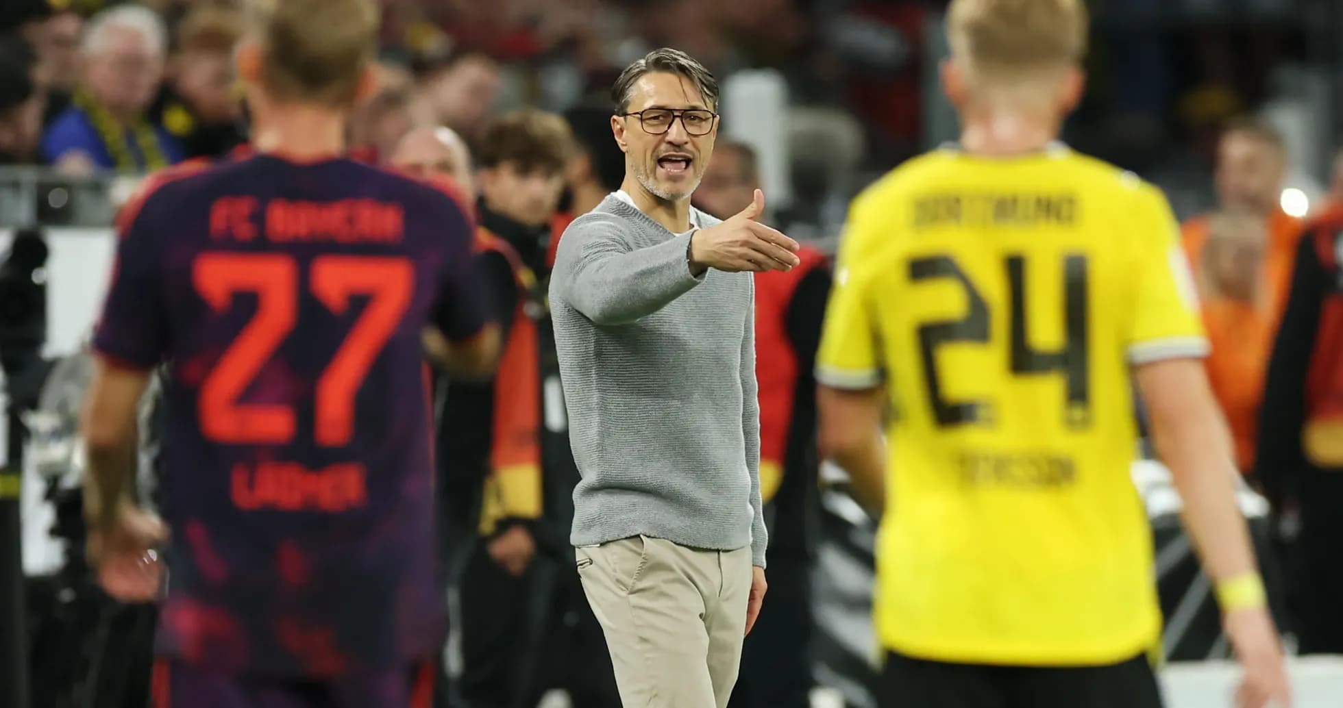 Coach directing players during a Bundesliga match Coach directing players during a Bundesliga match