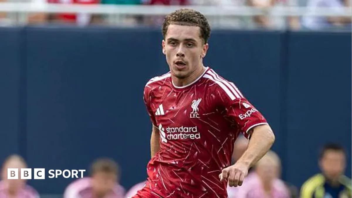 Player running on the field in Liverpool kit Player running on the field in Liverpool kit