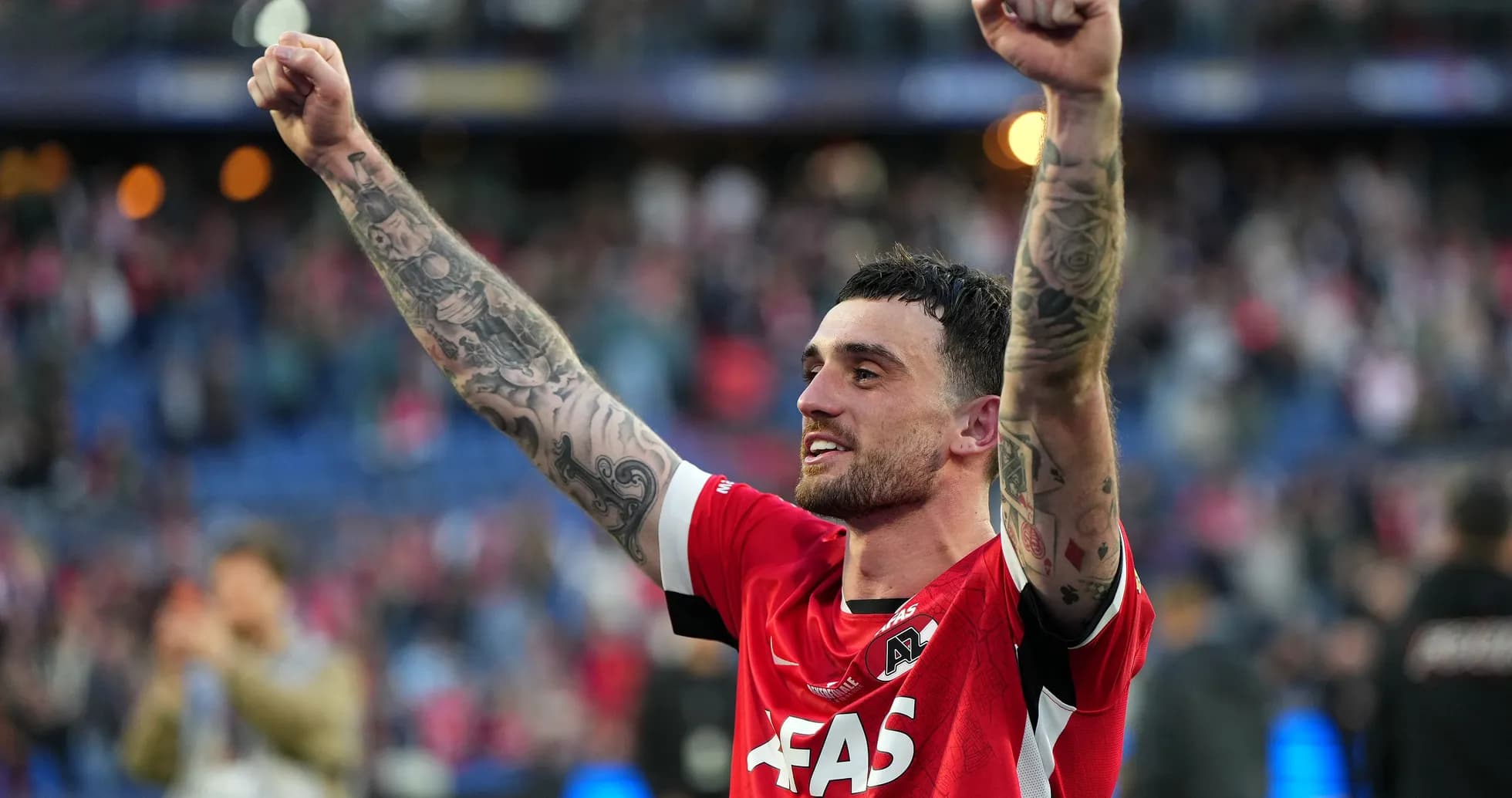 Player celebrating with raised fists after match Player celebrating with raised fists after match