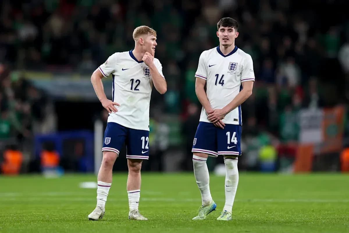 Two England players standing on the pitch post-match Two England players standing on the pitch post-match