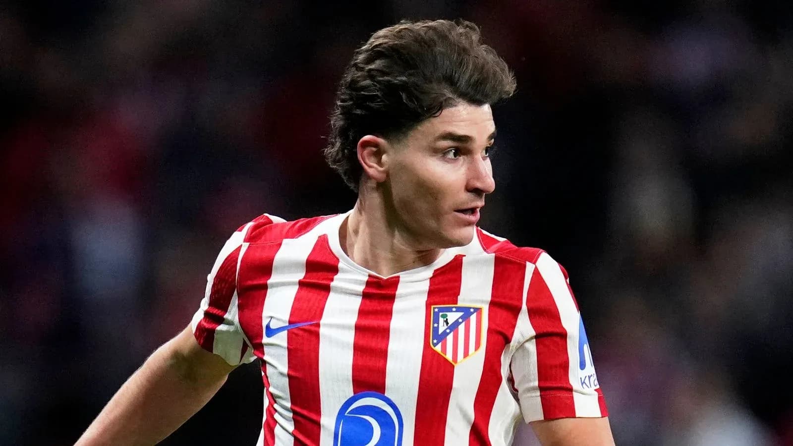 Atletico Madrid player running during match Atletico Madrid player running during match