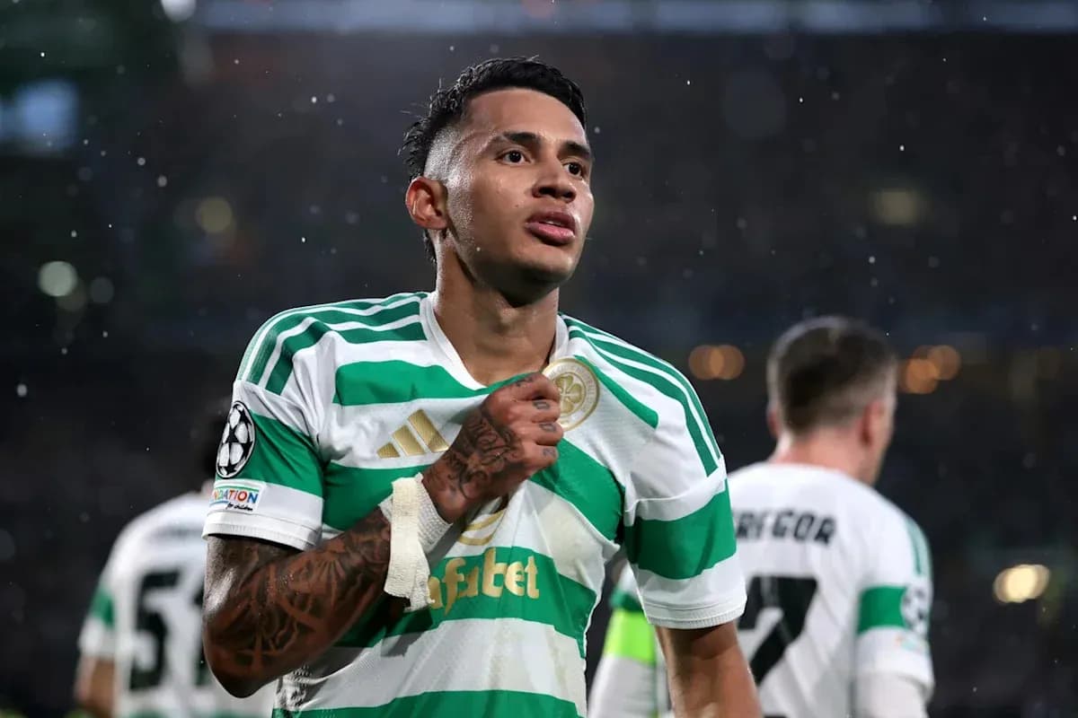 Player celebrating with Celtic jersey after match Player celebrating with Celtic jersey after match
