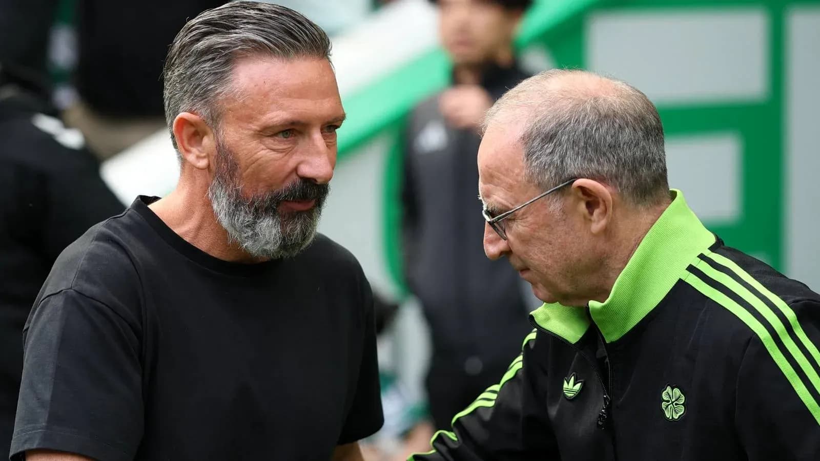 Two coaches interacting before a match Two coaches interacting before a match