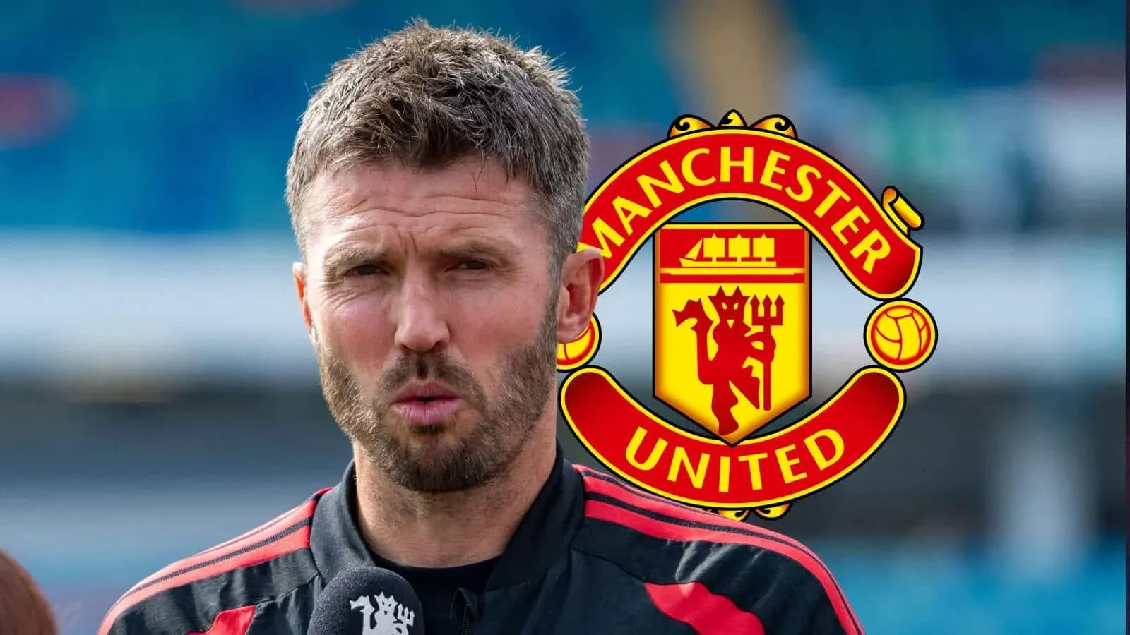 Coach speaking during press conference with Manchester United logo Coach speaking during press conference with Manchester United logo