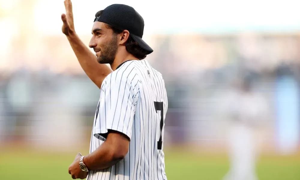 Man in Yankees jersey waving to the crowd Man in Yankees jersey waving to the crowd