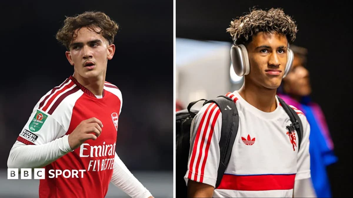 Two young football players in team kits Two young football players in team kits
