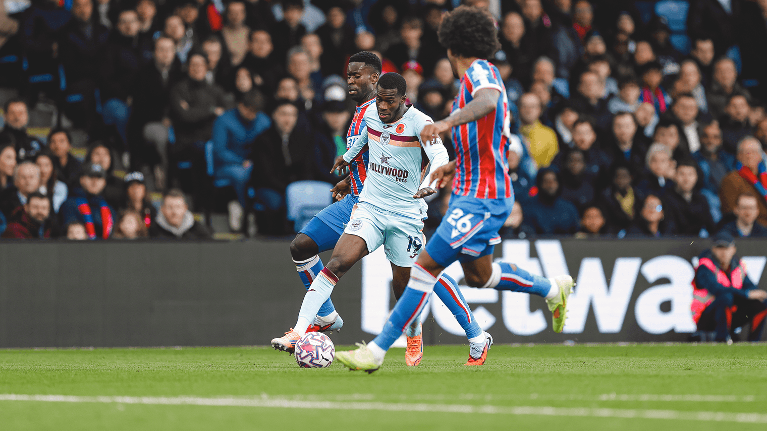 Brentford player challenged by Crystal Palace defenders Brentford player challenged by Crystal Palace defenders
