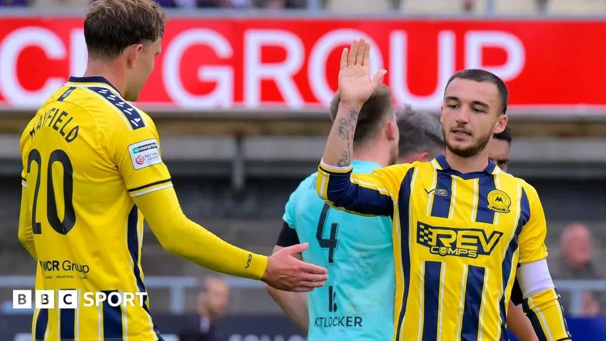 Two players interacting during a football match Two players interacting during a football match