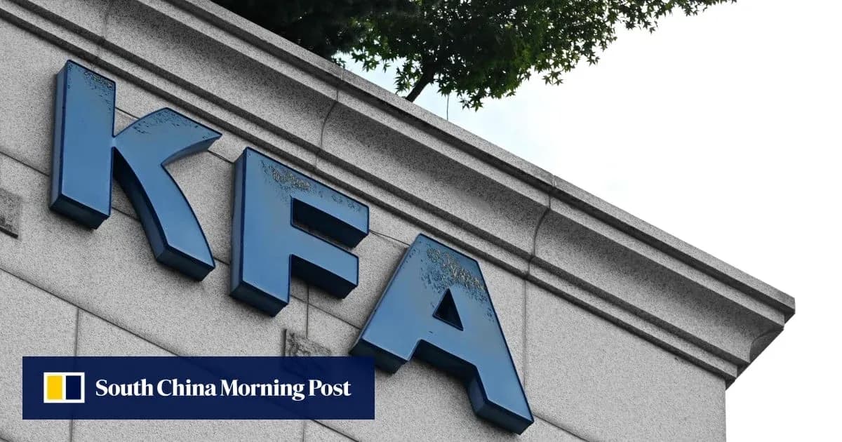 KFA sign on building exterior with trees above KFA sign on building exterior with trees above